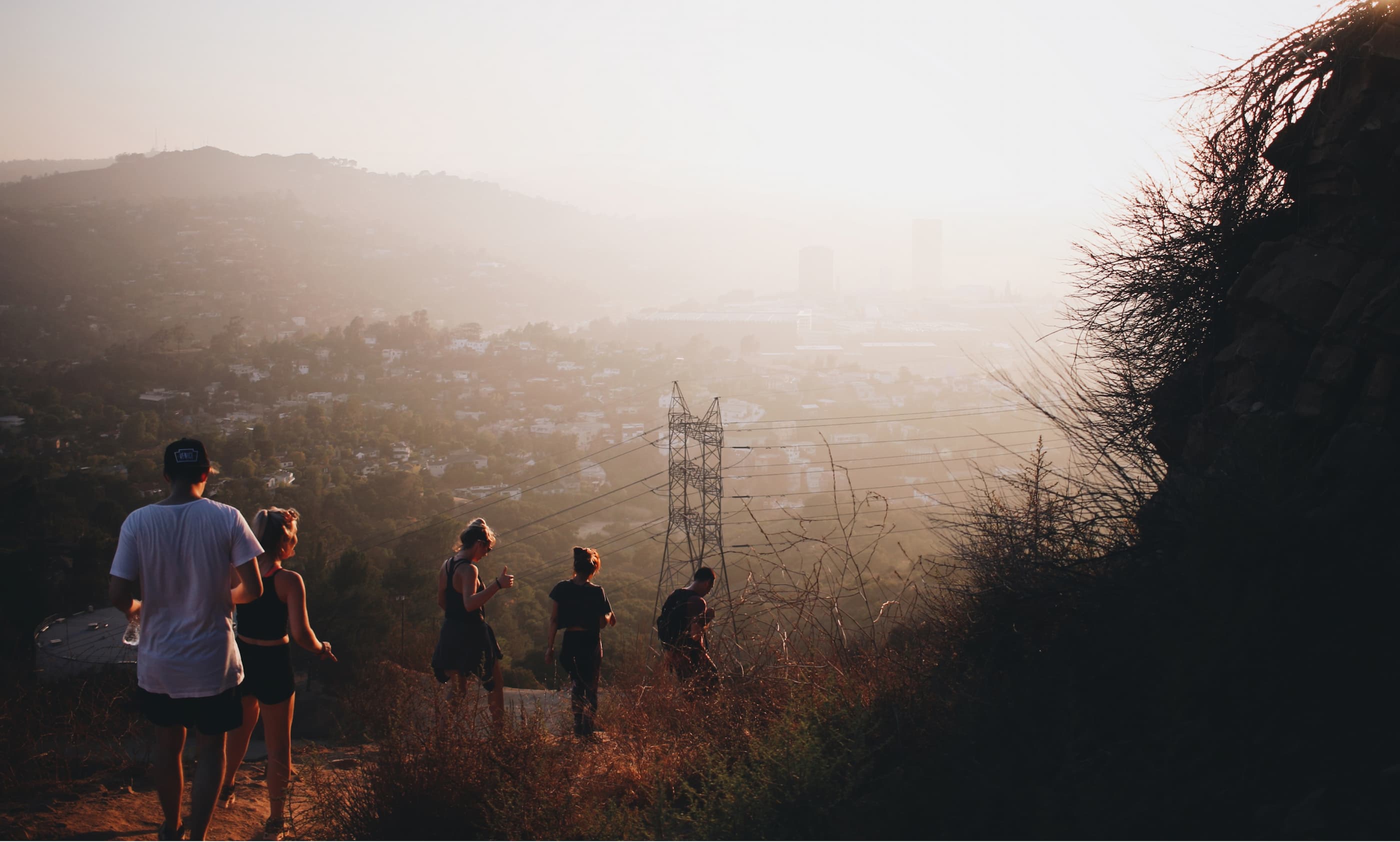 A group of people hiking down a hill